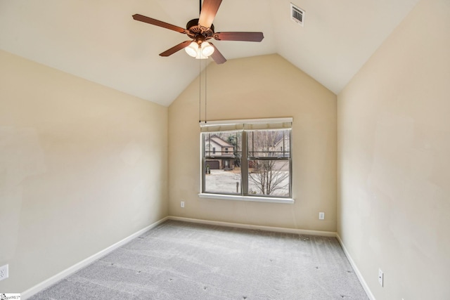 unfurnished room with ceiling fan, light colored carpet, and lofted ceiling