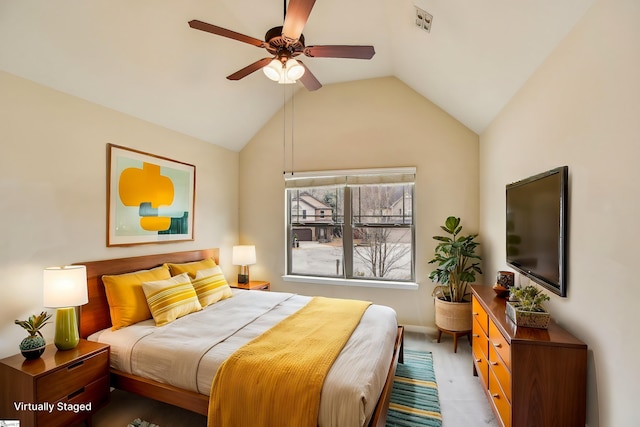 carpeted bedroom featuring lofted ceiling and ceiling fan