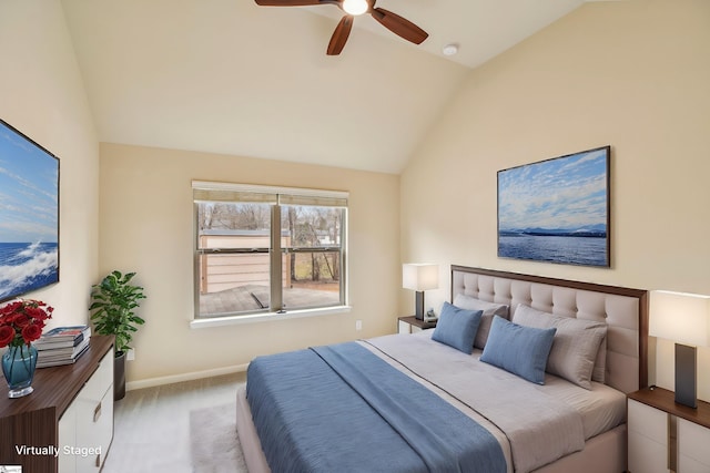 carpeted bedroom featuring ceiling fan and lofted ceiling