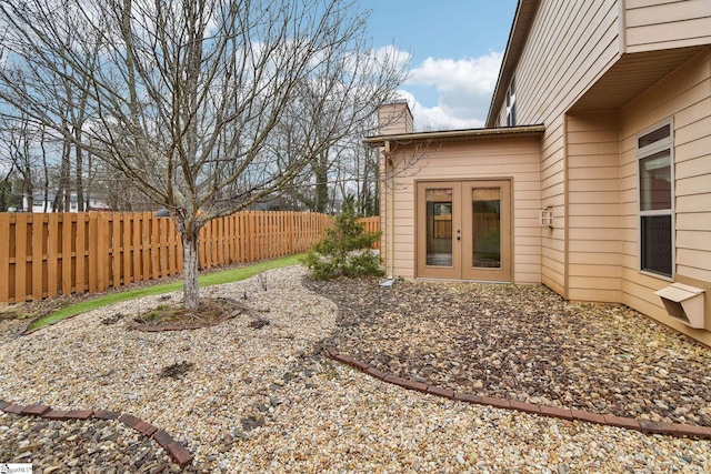 view of yard with french doors