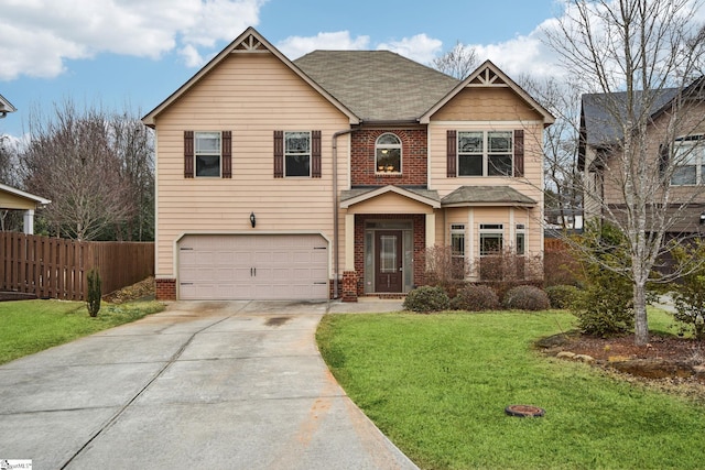 view of front of property featuring a garage and a front lawn