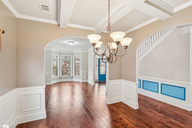 unfurnished dining area featuring beam ceiling, coffered ceiling, ornamental molding, dark hardwood / wood-style flooring, and a chandelier