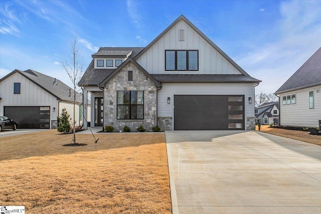 modern farmhouse with a garage and a front lawn