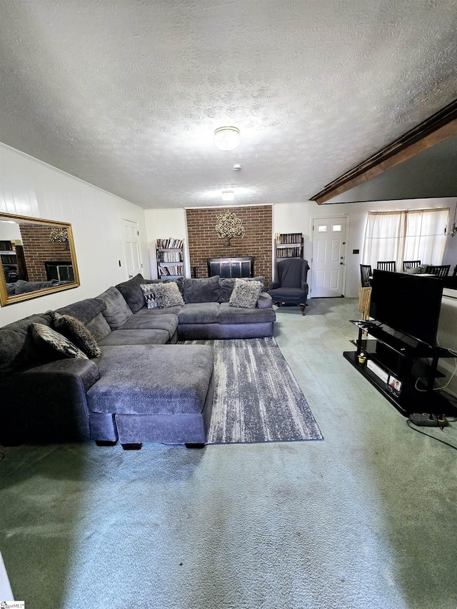 living room with a brick fireplace, carpet floors, and a textured ceiling