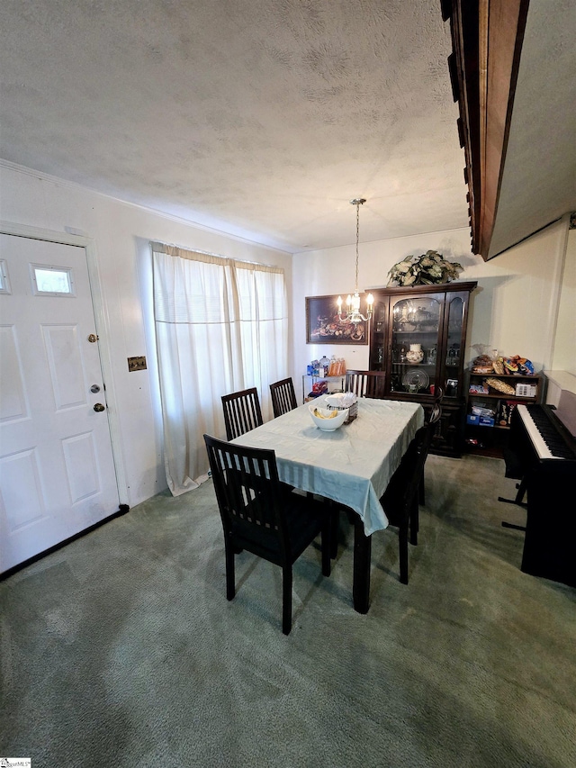 carpeted dining area featuring a notable chandelier and a textured ceiling