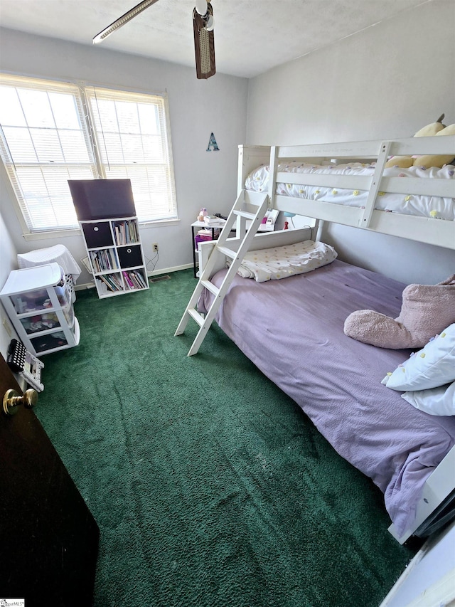 carpeted bedroom with ceiling fan