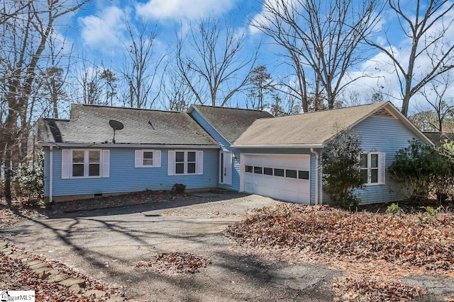 ranch-style house featuring a garage