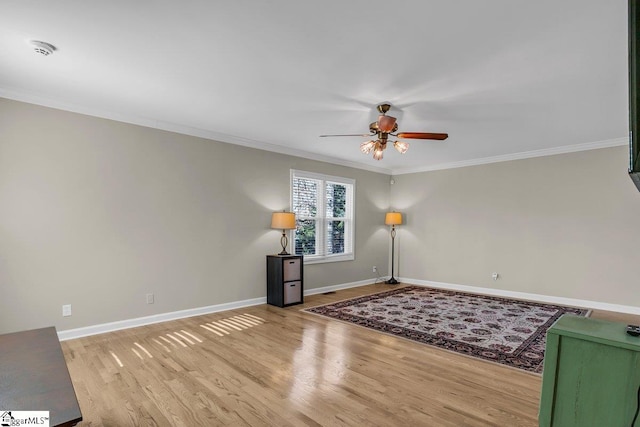 unfurnished room featuring crown molding, ceiling fan, and light hardwood / wood-style floors