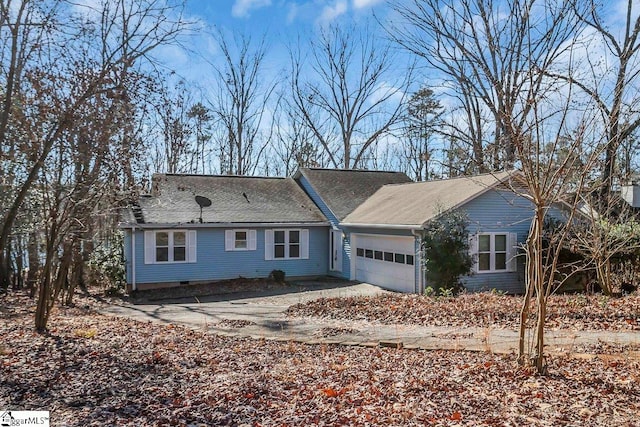 ranch-style home featuring a garage