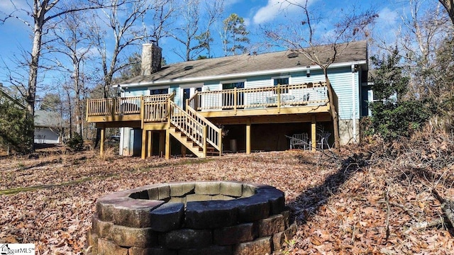 back of property featuring a wooden deck