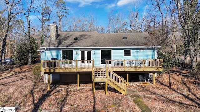 rear view of house featuring a deck