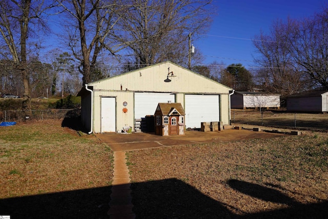 garage featuring a lawn