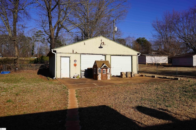 garage featuring a lawn