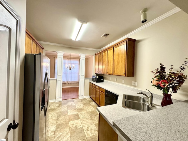 kitchen featuring ornate columns, ornamental molding, sink, and black appliances