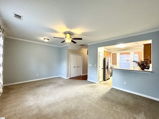 unfurnished living room featuring carpet floors, ornamental molding, decorative columns, and ceiling fan