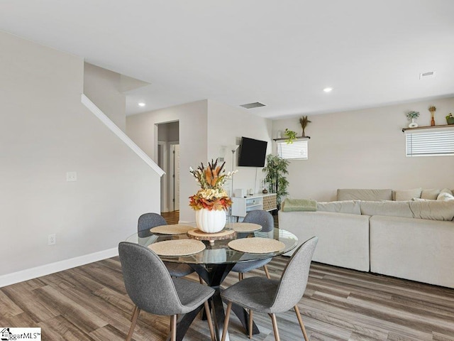 dining area with hardwood / wood-style flooring