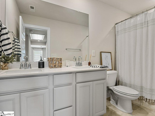 full bathroom with shower / bath combination with curtain, vanity, toilet, and tile patterned flooring