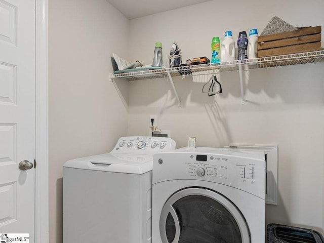 washroom with washer and dryer