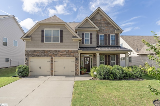 craftsman inspired home with a porch, a garage, and a front lawn