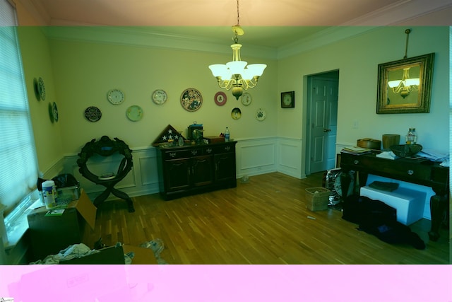 misc room with a notable chandelier, crown molding, and hardwood / wood-style flooring