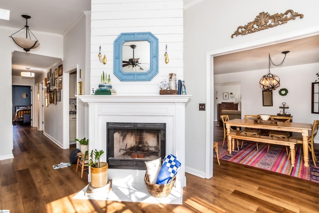 interior space with dark wood-type flooring and crown molding