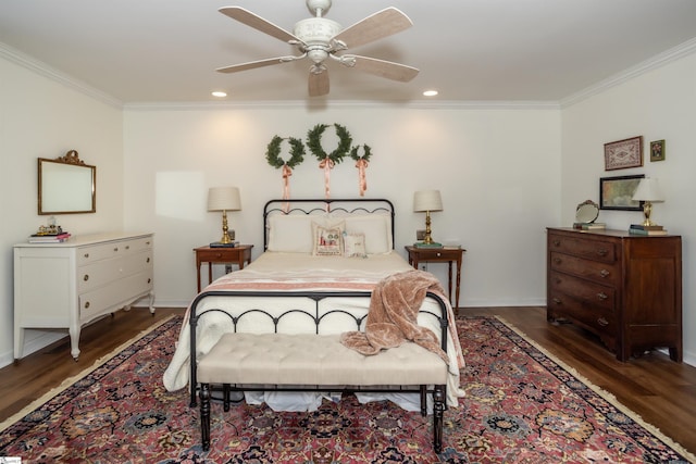 bedroom with ornamental molding, dark hardwood / wood-style floors, and ceiling fan