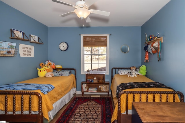 bedroom with wood-type flooring and ceiling fan