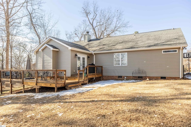 rear view of house featuring a yard, a deck, and french doors