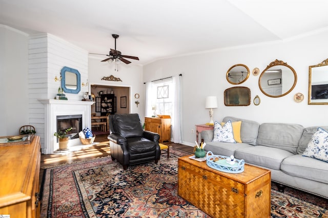 living room featuring ceiling fan, crown molding, and dark hardwood / wood-style flooring