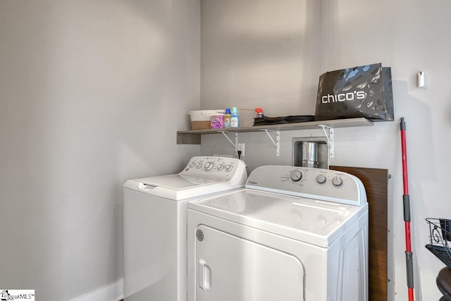 laundry room with washing machine and clothes dryer