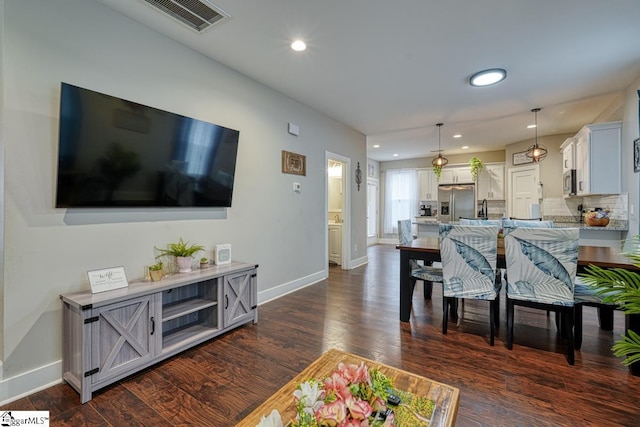 living room featuring dark hardwood / wood-style flooring