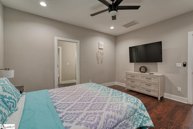 bedroom with dark hardwood / wood-style floors and ceiling fan