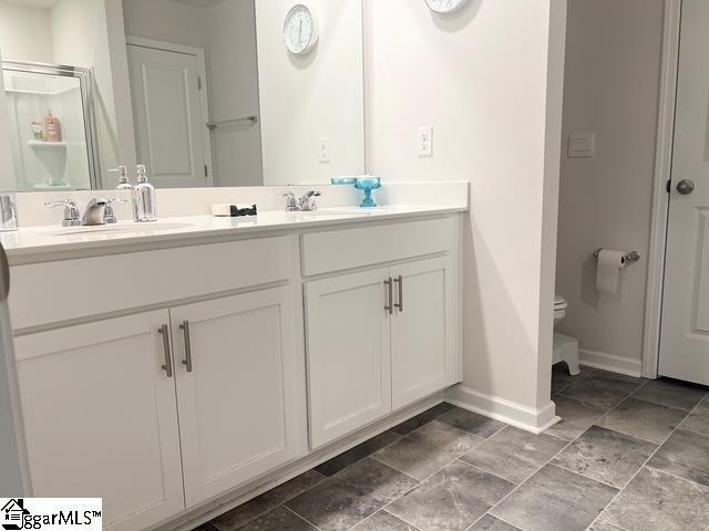 bathroom with vanity and toilet