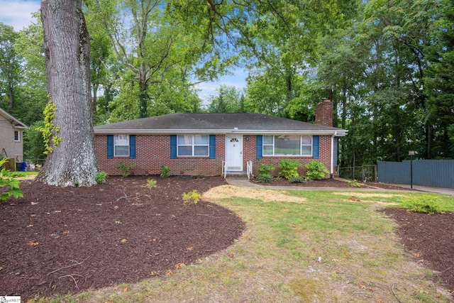 single story home featuring a front yard