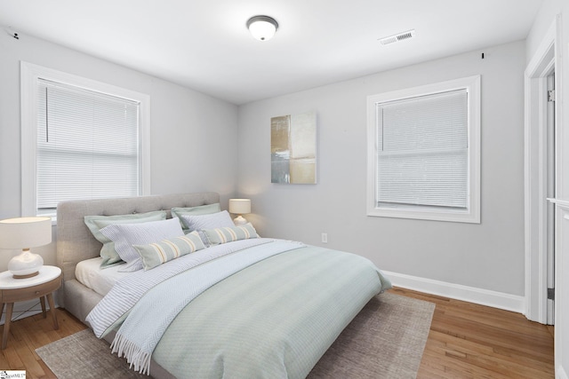 bedroom with wood-type flooring