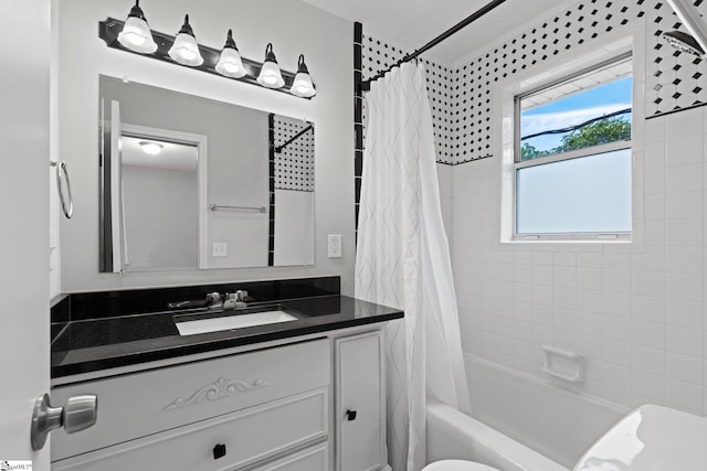 bathroom featuring vanity and shower / bathtub combination with curtain