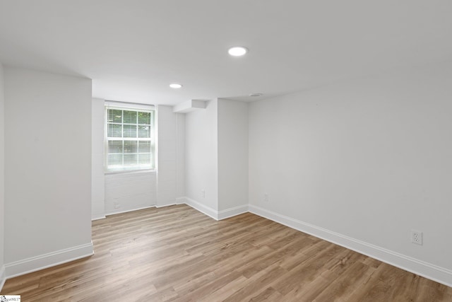 unfurnished room with light wood-type flooring