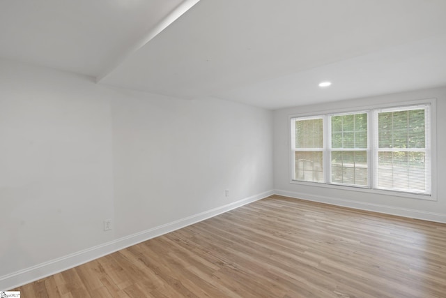 spare room with light hardwood / wood-style flooring