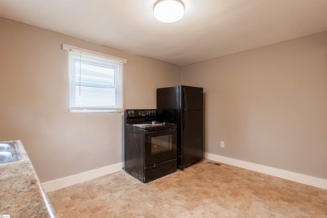 kitchen featuring sink and black appliances