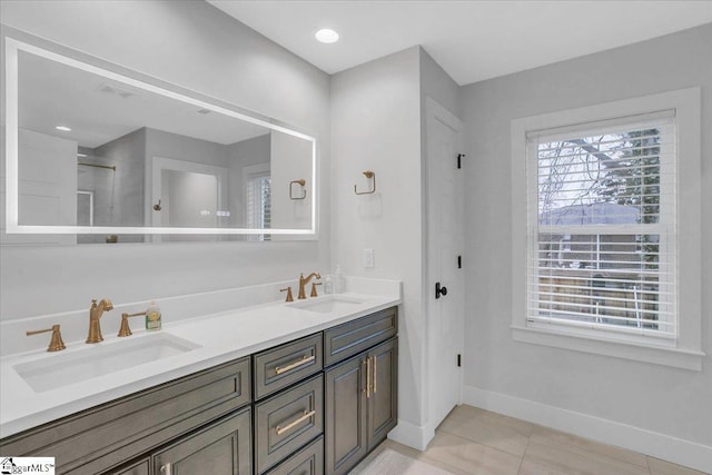 bathroom with tile patterned flooring and vanity