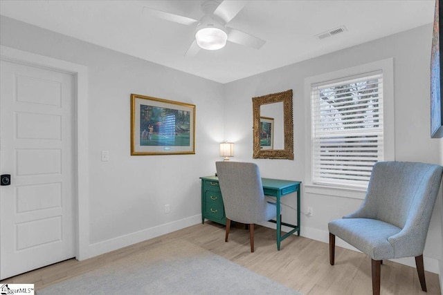 office space with ceiling fan and light hardwood / wood-style flooring