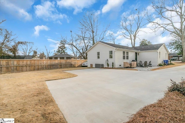 view of side of property featuring a patio