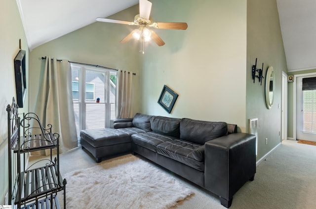 living room featuring ceiling fan, plenty of natural light, light carpet, and high vaulted ceiling