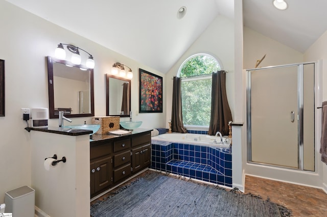 bathroom with lofted ceiling, separate shower and tub, and vanity