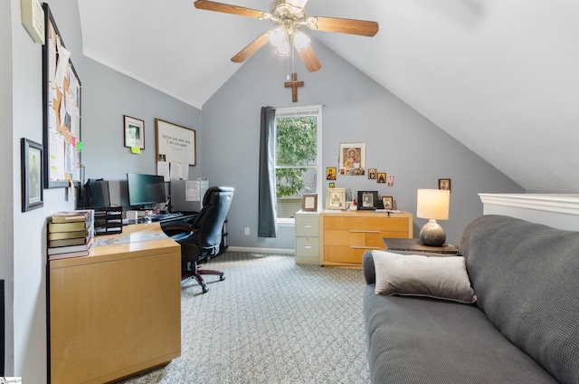 carpeted home office featuring vaulted ceiling and ceiling fan