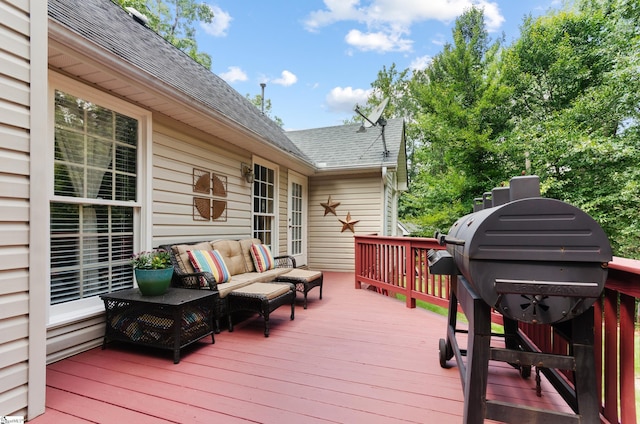 deck with grilling area and an outdoor living space