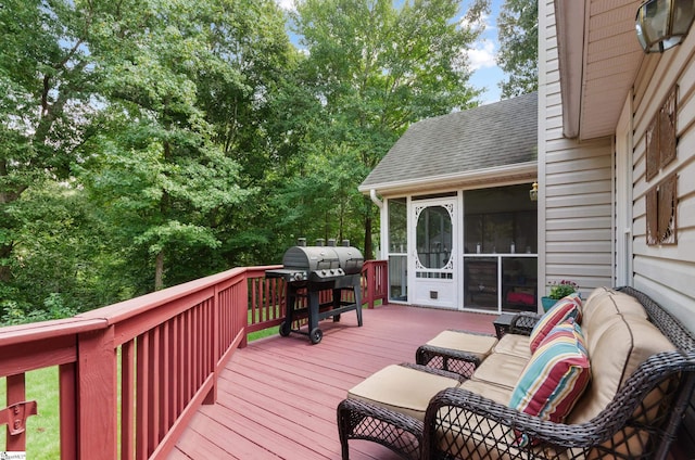 wooden terrace with a grill and a sunroom