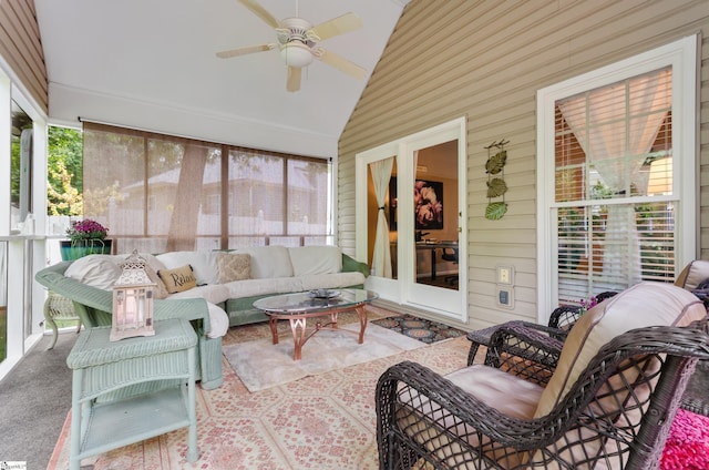 sunroom featuring ceiling fan and vaulted ceiling