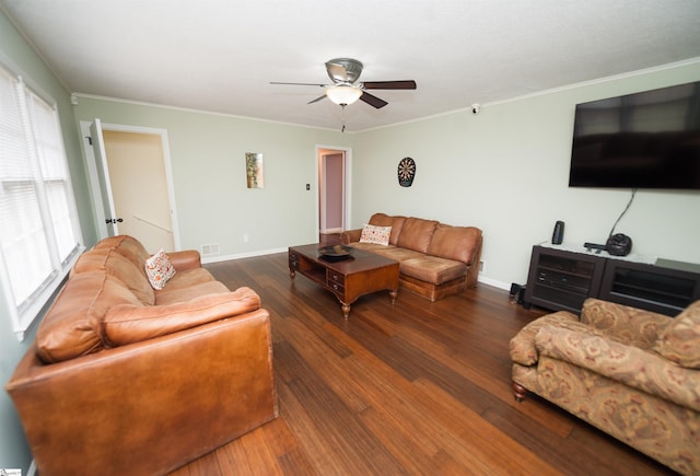 living room with dark wood-type flooring, ceiling fan, and ornamental molding