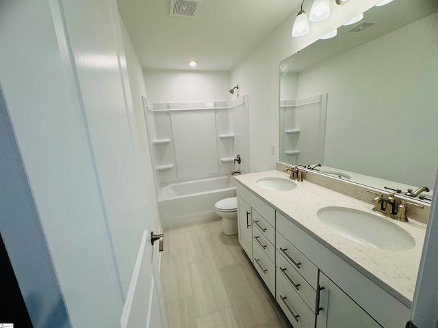 full bathroom with  shower combination, toilet, and vanity